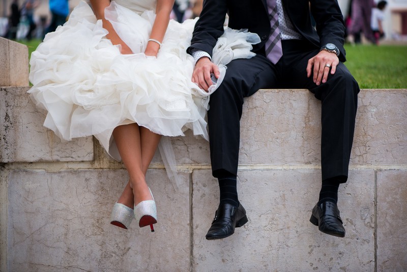 Couple on honeymoon and bride with Louboutin shoes
