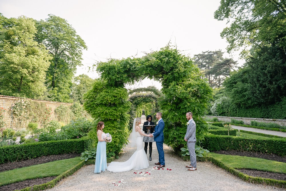 Elopement ceremony in Jardin de Bagetelle in Paris. Bride and groom and Paris officiant Elopement ceremony in Jardin de Bagetelle in Paris. Bride and groom and Paris officiant
