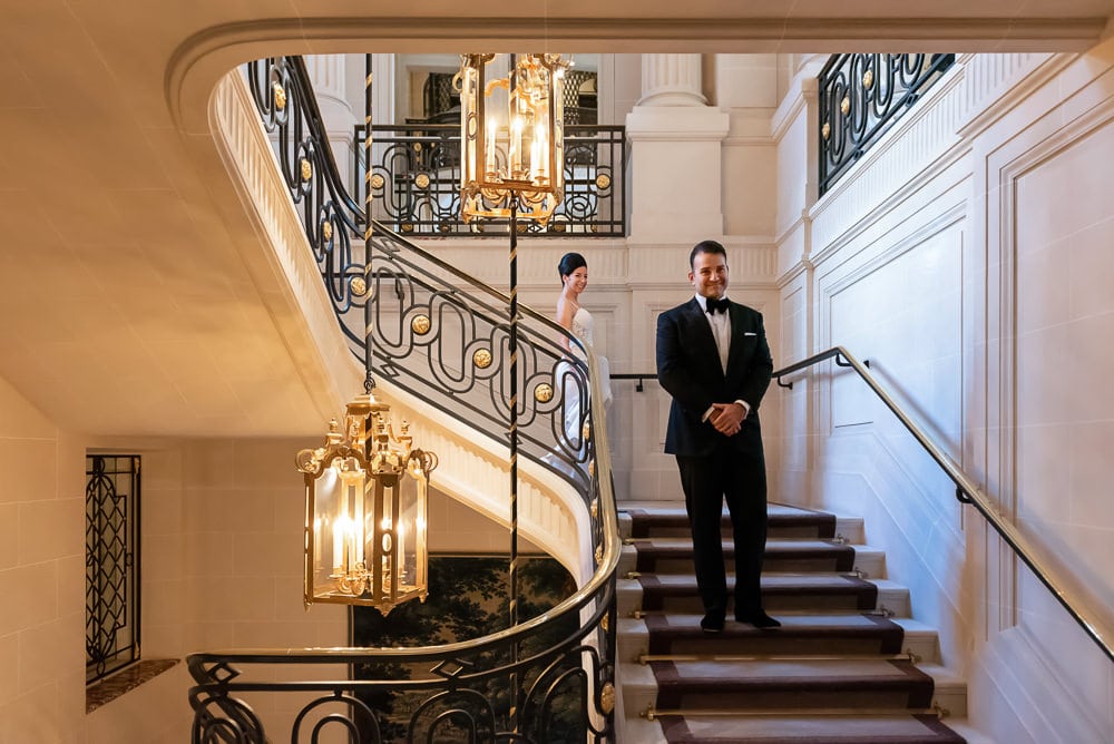 Bride and groom first look on the stairs of Hotel Crillon Bride and groom first look on the stairs of Hotel Crillon