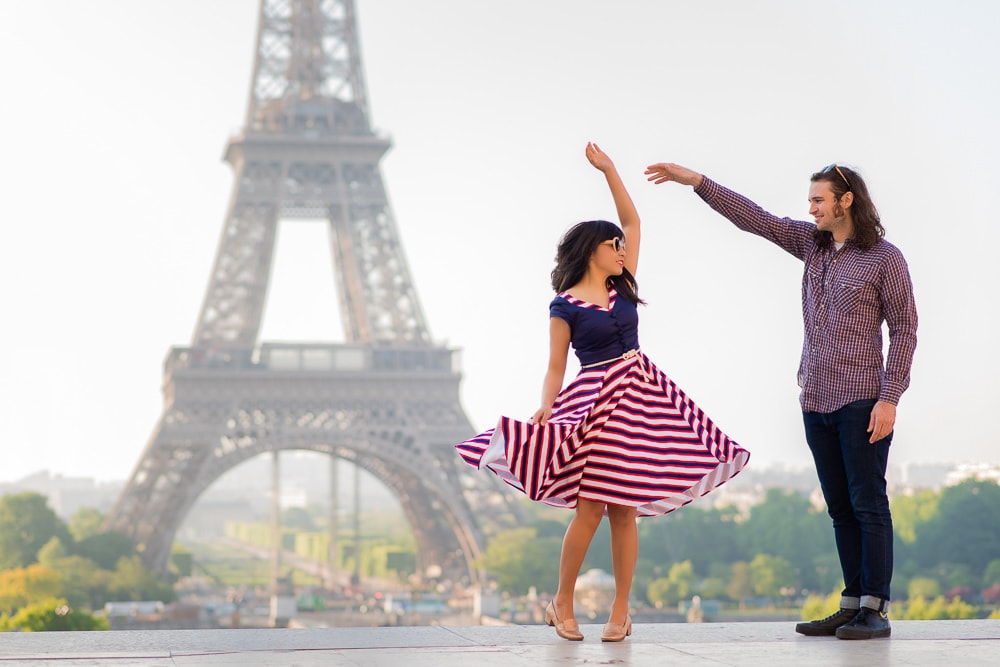Couple dancing in front of the Eiffel Tower Couple dancing in front of the Eiffel Tower