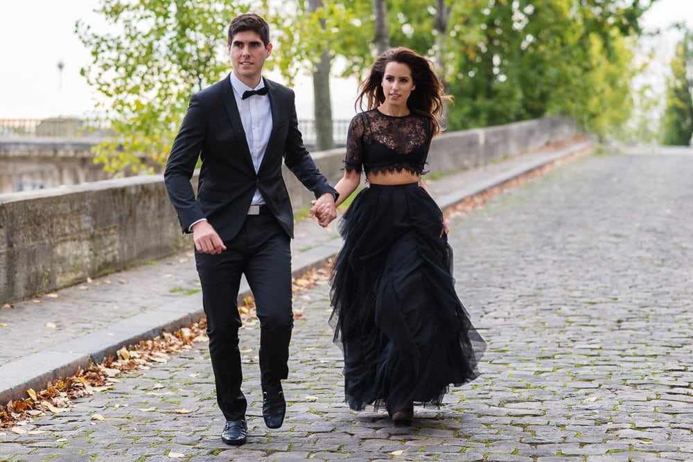 Elegantly dressed couple from Miami walking in the streets of Paris Elegantly dressed couple from Miami walking in the streets of Paris