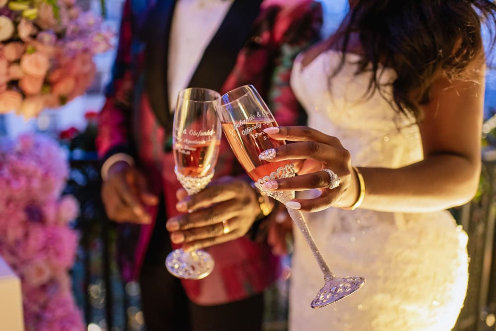 Plaza Athenee Paris Wedding - Bride and groom toasting with personalized champagne glasses Plaza Athenee Paris Wedding - Bride and groom toasting with personalized champagne glasses