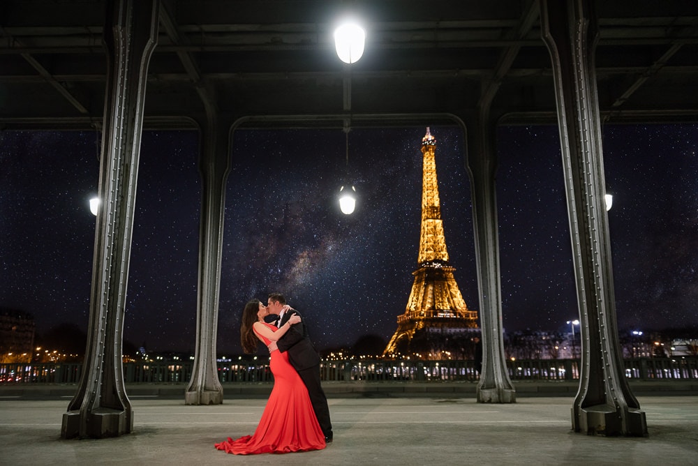 Pre wedding couple kissing at the Eiffel Tower by night where the milky way is showing Pre wedding couple kissing at the Eiffel Tower by night where the milky way is showing