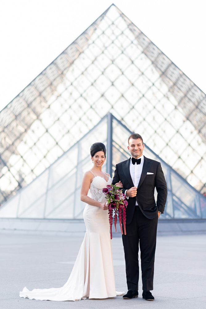 Stylish couple posing for their bride and groom portraits on the day of their Crillon wedding in Paris Stylish couple posing for their bride and groom portraits on the day of their Crillon wedding in Paris