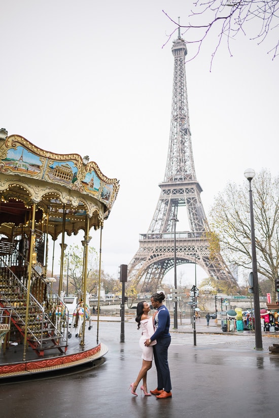 Kissin in the street near the Carousel of the Eiffel Tower